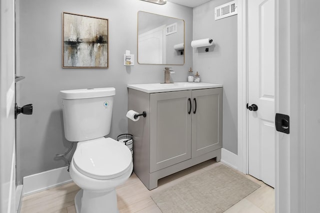 820 Exmoor Rd, Olympia Fields, IL 60461 - half bathroom featuring vanity, toilet, and baseboards