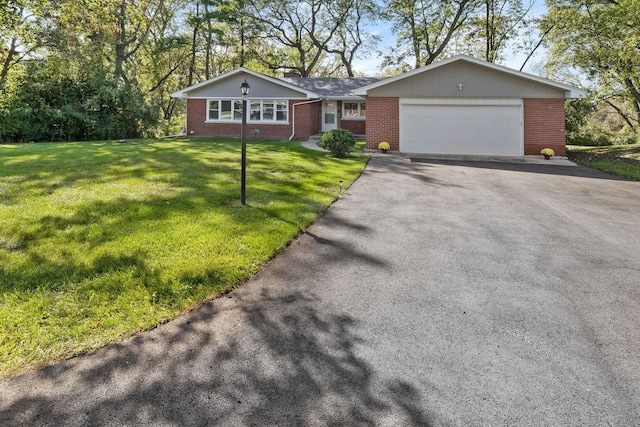 820 Exmoor Rd, Olympia Fields, IL 60461 - ranch-style house featuring brick siding, driveway, a garage, a front yard, and a chimney