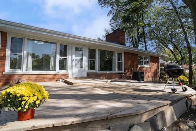 820 Exmoor Rd, Olympia Fields, IL 60461 - back of property featuring brick siding, a chimney, a deck, and central AC unit