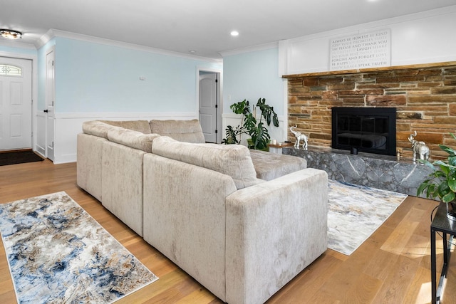 820 Exmoor Rd, Olympia Fields, IL 60461 - living room featuring crown molding, light wood-type flooring, recessed lighting, a wainscoted wall, and a fireplace