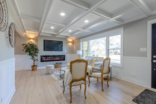 interior space with beamed ceiling, light hardwood / wood-style floors, and coffered ceiling