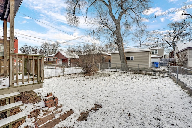 yard covered in snow featuring an outbuilding