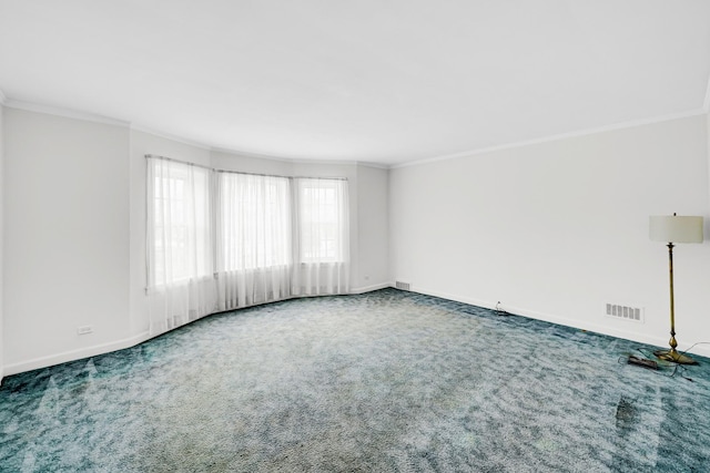 carpeted empty room featuring ornamental molding