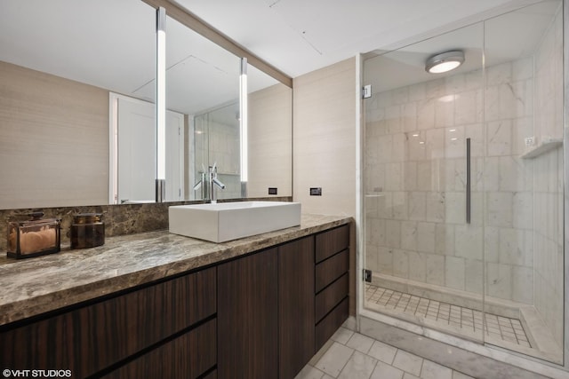 bathroom featuring vanity, tile patterned floors, and a shower with door