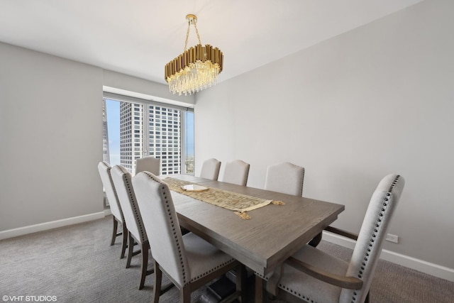 carpeted dining area with a notable chandelier