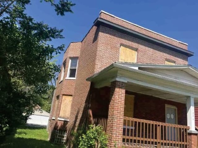 view of home's exterior with covered porch