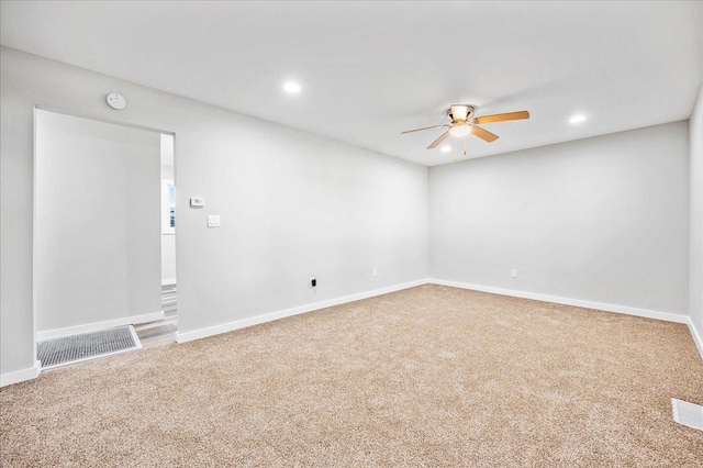 405 N Walnut St, Onarga, IL 60955 - empty room with a ceiling fan, carpet, recessed lighting, a smoke detector, and baseboards