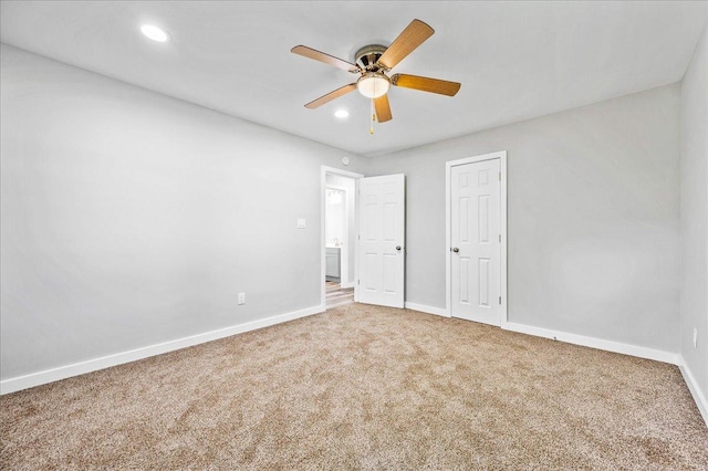 unfurnished bedroom featuring carpet and ceiling fan