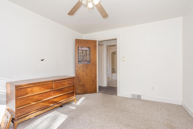 unfurnished bedroom featuring carpet flooring and ceiling fan