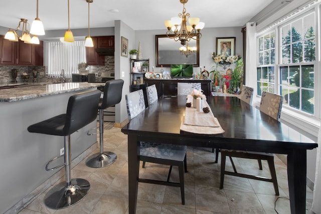 dining room with a notable chandelier