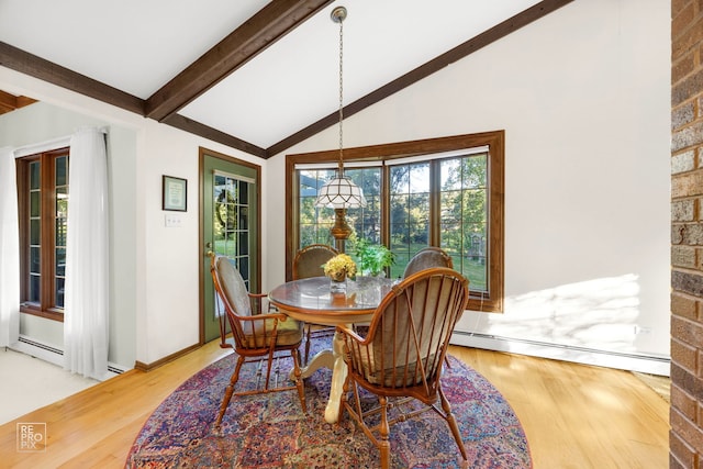 dining area with lofted ceiling with beams, wood-type flooring, and a baseboard heating unit