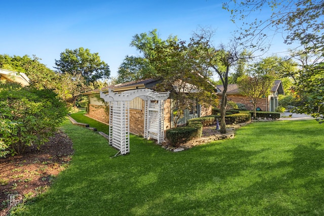 view of outdoor structure featuring a yard