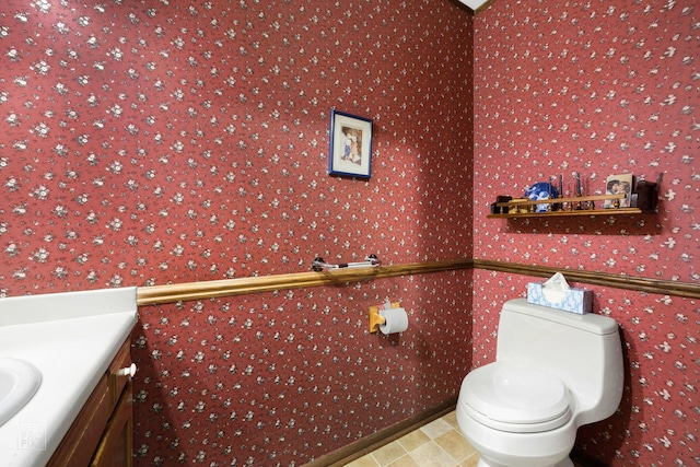 bathroom featuring vanity and toilet