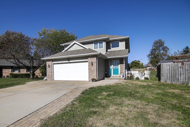 view of front of property featuring a garage and a front lawn