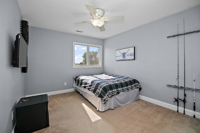 carpeted bedroom with ceiling fan