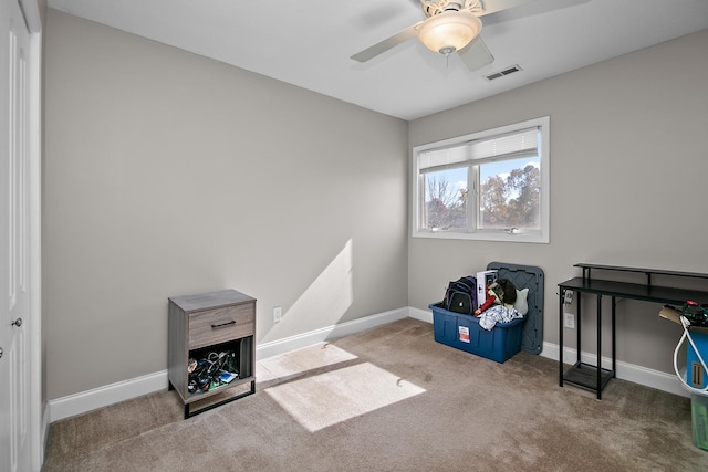 misc room with light carpet and ceiling fan