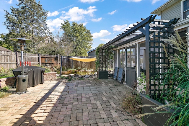 view of patio / terrace with a sunroom