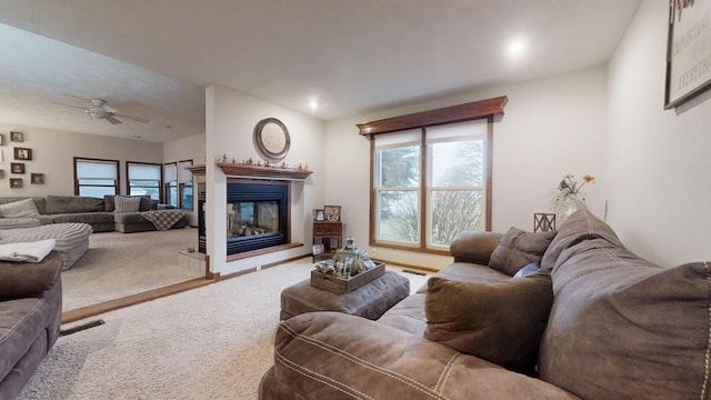 living room with carpet flooring and ceiling fan