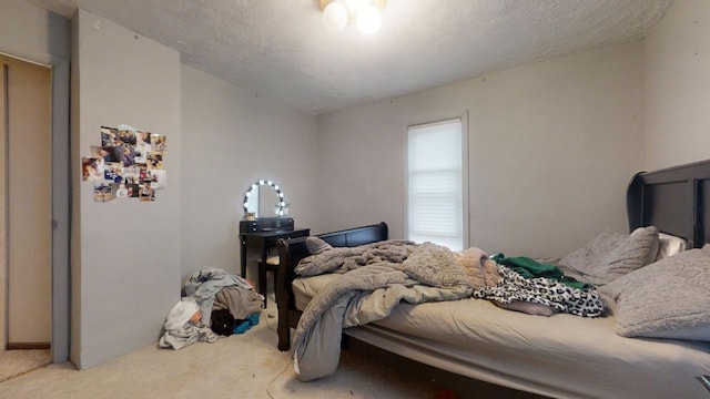 carpeted bedroom with a textured ceiling