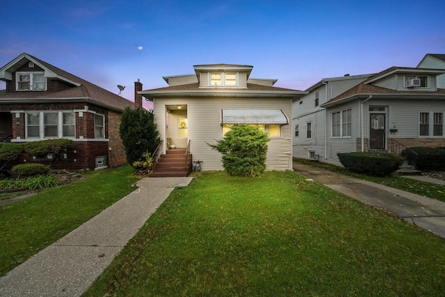 view of front of home with a lawn