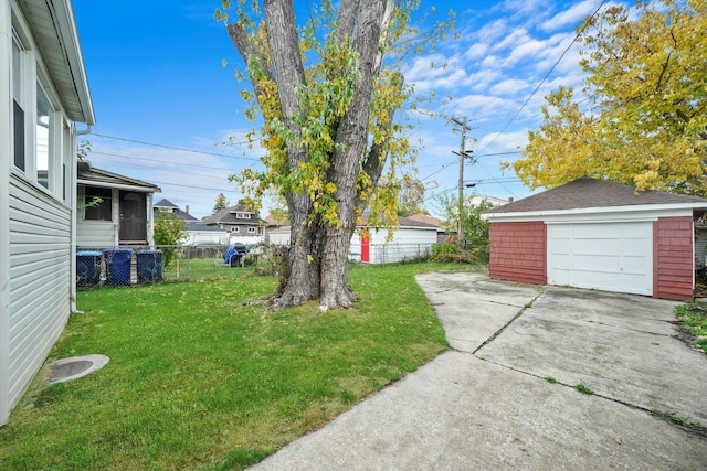 view of yard featuring a garage and an outdoor structure