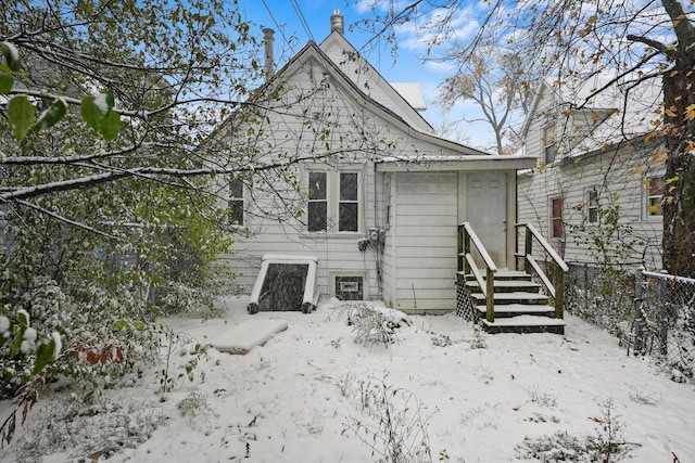 view of snow covered house