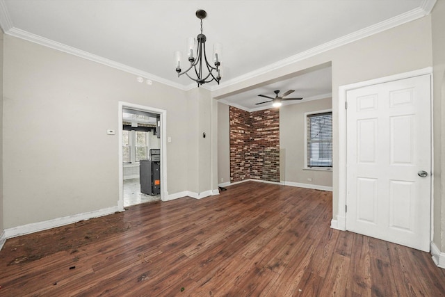 unfurnished dining area featuring dark hardwood / wood-style floors, ornamental molding, ceiling fan with notable chandelier, and brick wall