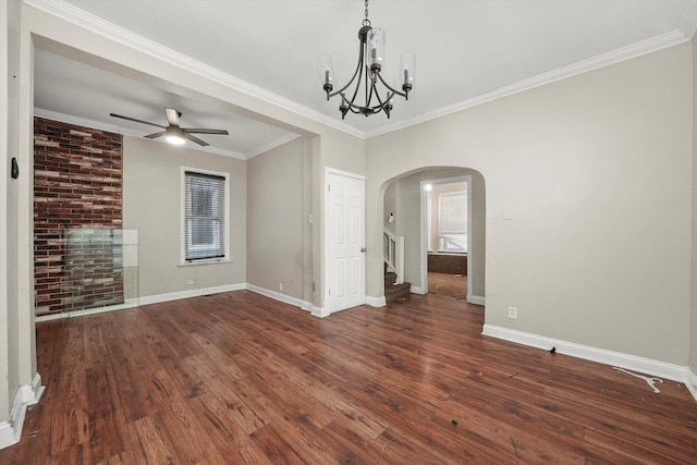 unfurnished room featuring ceiling fan with notable chandelier, dark hardwood / wood-style flooring, and ornamental molding