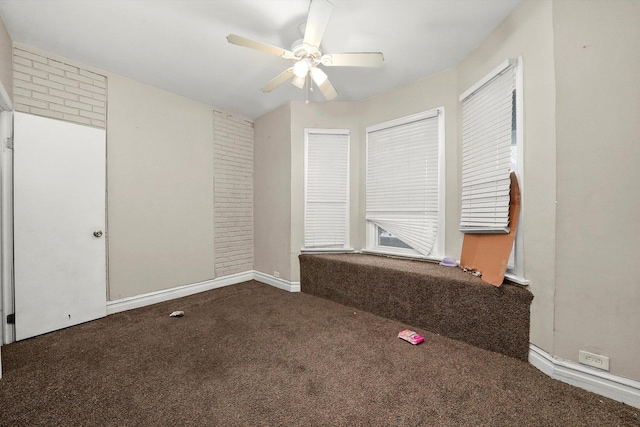 spare room featuring carpet flooring and ceiling fan