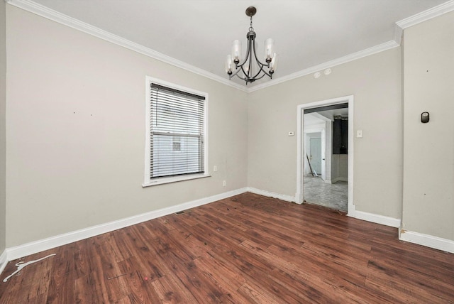 unfurnished room featuring ornamental molding, dark wood-type flooring, and a chandelier