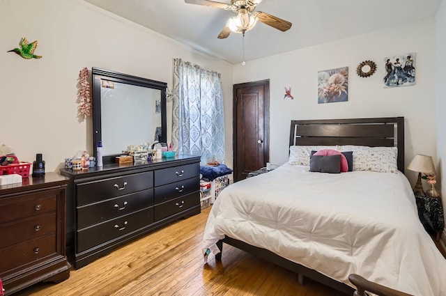 bedroom featuring ceiling fan and light hardwood / wood-style floors