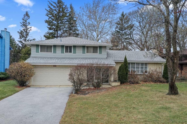 tri-level home featuring a front yard and a garage