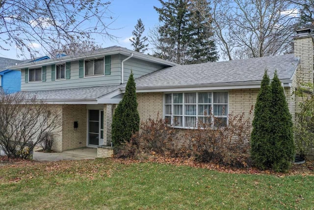 split level home with a front yard