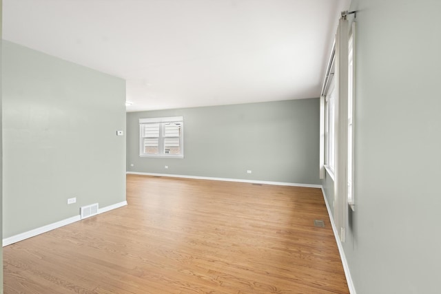 empty room with light wood-type flooring