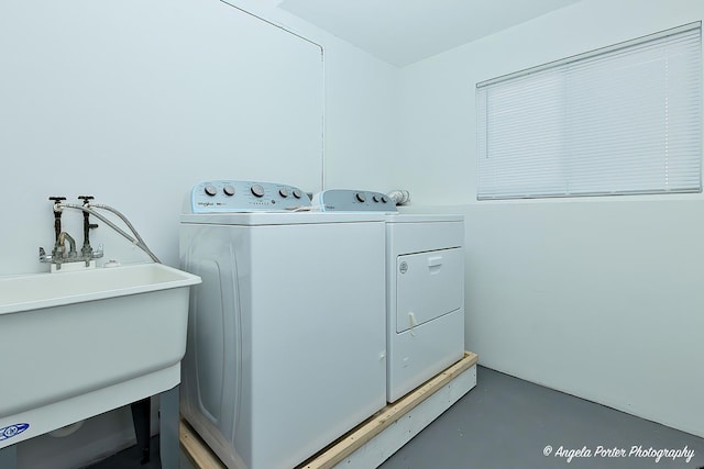 washroom featuring separate washer and dryer and sink