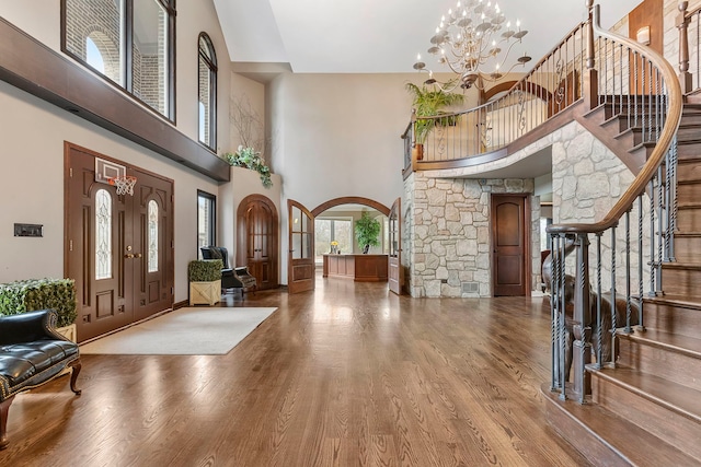 5N259 Wilton Croft Rd, Saint Charles, IL 60175 - entryway with a high ceiling, stairs, arched walkways, wood finished floors, and a chandelier