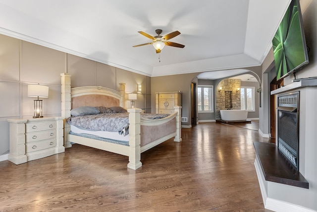 unfurnished bedroom featuring ceiling fan and dark wood-type flooring