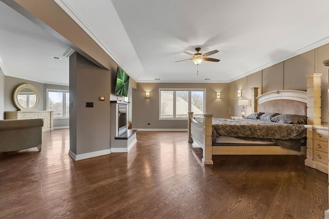 5N259 Wilton Croft Rd, Saint Charles, IL 60175 - bedroom featuring a fireplace with raised hearth, ornamental molding, dark wood-type flooring, baseboards, and ceiling fan