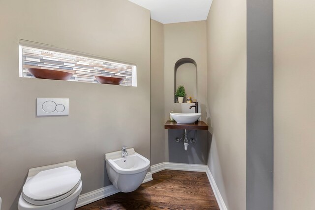 5N259 Wilton Croft Rd, Saint Charles, IL 60175 - half bathroom with a sink, a bidet, wood finished floors, toilet, and baseboards