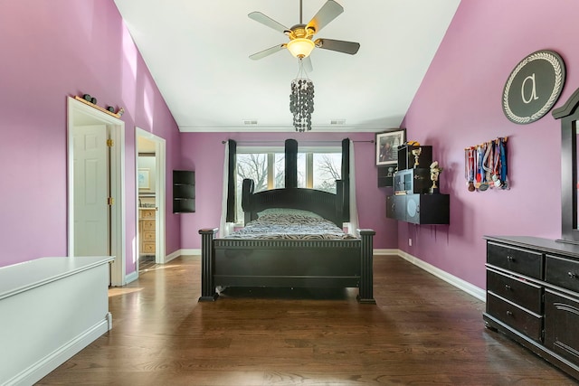 bedroom with dark hardwood / wood-style flooring, vaulted ceiling, ceiling fan, and ornamental molding