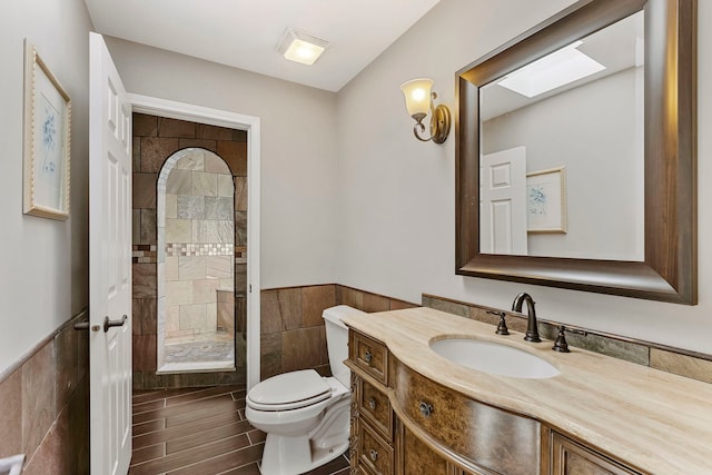 5N259 Wilton Croft Rd, Saint Charles, IL 60175 - bathroom with tile walls, a tile shower, toilet, a wainscoted wall, and vanity