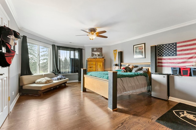 bedroom with hardwood / wood-style flooring, ceiling fan, stainless steel fridge, and ornamental molding