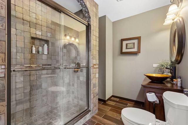 5N259 Wilton Croft Rd, Saint Charles, IL 60175 - bathroom featuring toilet, wood finish floors, a shower stall, baseboards, and vanity