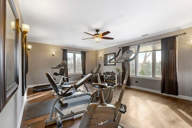 exercise room with hardwood / wood-style floors, ceiling fan, and ornamental molding