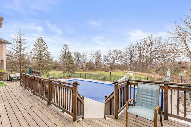 wooden deck featuring a covered pool