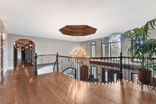 5N259 Wilton Croft Rd, Saint Charles, IL 60175 - corridor with a chandelier, an upstairs landing, arched walkways, wood finished floors, and baseboards