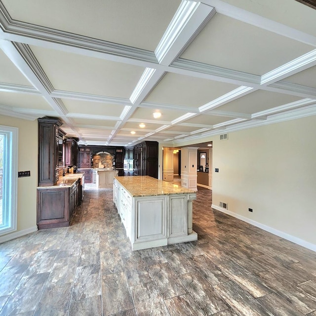 5N259 Wilton Croft Rd, Saint Charles, IL 60175 - kitchen with coffered ceiling, a spacious island, dark brown cabinets, baseboards, and wood finished floors