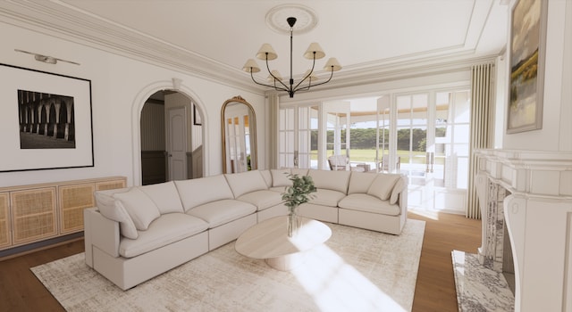 living room with ornamental molding, hardwood / wood-style flooring, and a notable chandelier