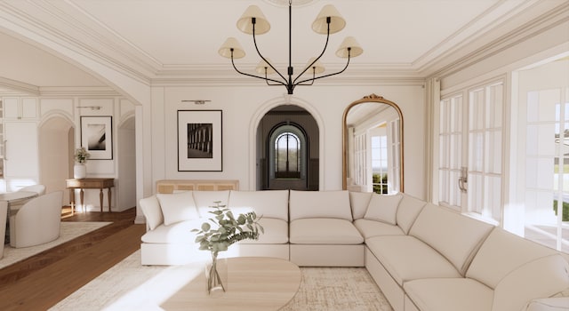 living room featuring a chandelier, hardwood / wood-style floors, and ornamental molding