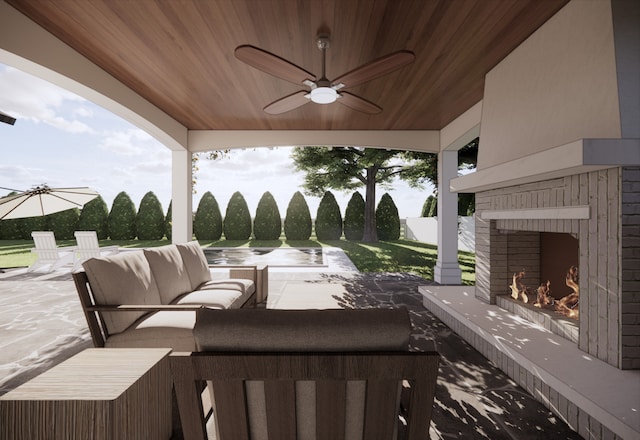 view of patio / terrace featuring an outdoor living space with a fireplace and ceiling fan